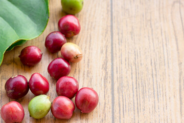 Naklejka na ściany i meble Close up fresh coffee beans on wood table