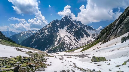 A rugged alpine landscape with craggy peaks and glaciers