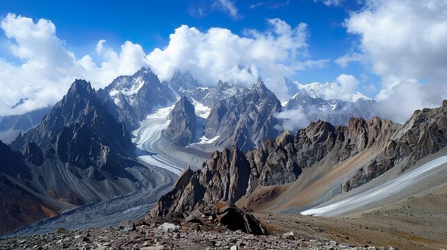 A rugged alpine landscape with craggy peaks and glaciers