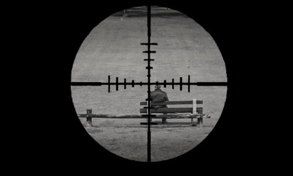 This is a clip from the short called "FULL CIRCLE" where we have aPOV shot of a sniper rifles scope aiming onto a target sitting on a park bench.