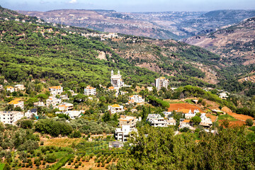 Aerial view of houses in picturesque valley between the mountains. Republic of Lebanon