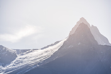 Peak of Peace Fighters and Alaudin with passes in the snow in the Fan Mountains early in the morning in Tajikistan, atmosphere in the Tien Shan highlands