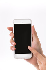 Hand is holding a modern touch screen phone.