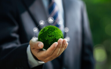Net zero and carbon neutral concept. Businessman holding world green with Sustainable Environment...