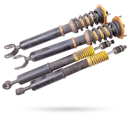 Shock absorber struts with black springs after being used on a car during replacement and repair on...