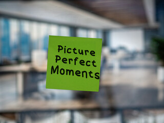 Post note on glass with 'Picture Perfect Moments'.