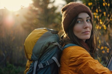 young female hiking or pacifist hiking and resting in a forest - obrazy, fototapety, plakaty