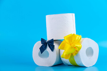 roll of toilet paper wrapped in gift bow. The concept of a valuable actual gift, a meme on the...