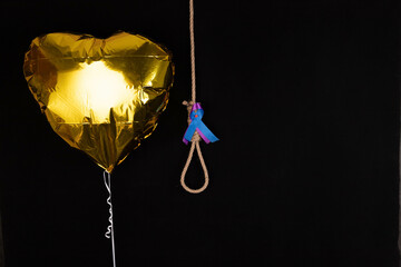 The concept of bullying, suicide. Rope strangulation loop on black background.