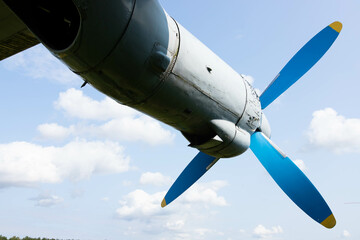 Wing and propellers of a civilian old aircraft. - obrazy, fototapety, plakaty