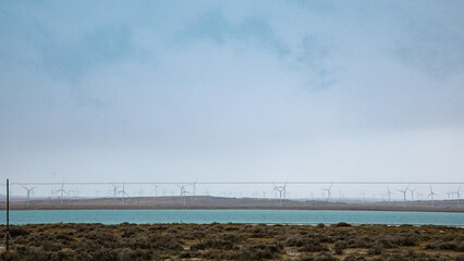Hainan Mongolian and Tibetan Autonomous Prefecture, Qinghai Province-Grasslands and roads under the snow-capped mountains