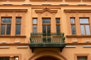 Wrought iron balcony on the facade of an old building.