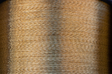 Spiral brass wire wound on a spool, ready for shipment. Belarusian Metallurgical Plant