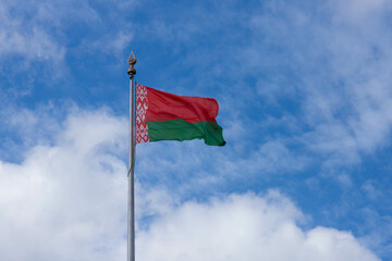Big state wind flag Republic of Belarus in Europe on blue sky background, copy space