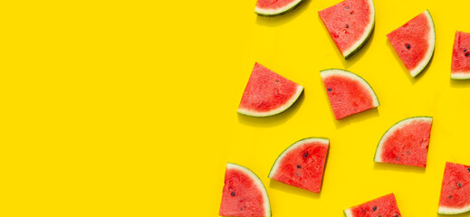 Watermelon slices on yellow background.