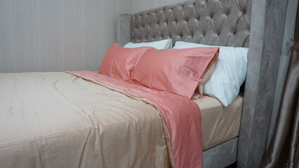 luxury beautiful color bedroom with comfort pillow cover bedding at hotel residence house curtain...