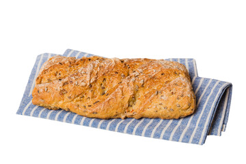 Freshly baked delicious french bread with napkin isolated on white background top view. Healthy white bread loaf