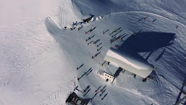 Chairlift Planseggbahn mountain station transporting skiers to the top