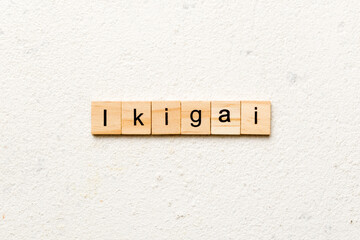 ikigai word written on wood block. ikigai text on table, concept