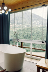 beautiful view of the mountains from the bathroom. modern interior in a house in nature - 763059245