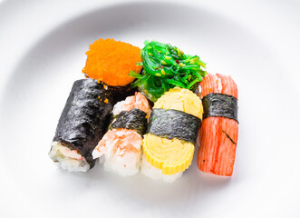 traditional Japanese sushi fresh and tasty on white.