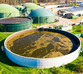 Biogas plant and farm in fields. Renewable energy from biomass. Agriculture prepared for Green Deal. Aerial view to Czech industry. Sustainable development in European Union.  - 763060848