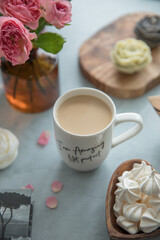 A portion of meringue in a small wooden plate in the shape of a heart