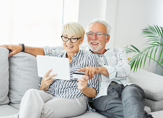 senior couple happy tablet together man woman shopping credit card buying order purchase online pay - 763073449