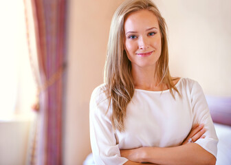 Naklejka premium Crossed arms, happy and portrait of woman in bedroom with happiness, confidence and pride in home. Fashion, beauty and face of person in house with casual style, trendy outfit and clothes on weekend