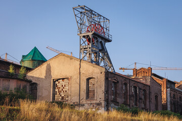 Fototapeta na wymiar Old shaft tower and buildings of former coal mine in Katowice, Poland