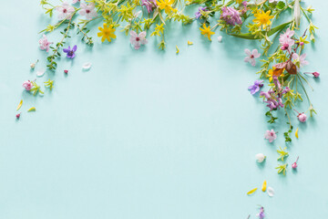 wild spring flowers on paper background - obrazy, fototapety, plakaty