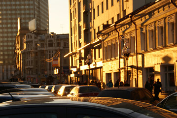Fototapeta na wymiar View of a busy street at sunset
