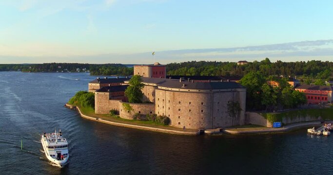 Aerial: Early Morning Light Reveals The Serene Beauty Of Vaxholm Fortress, Surrounded By The Calm Waters Of The Stockholm Archipelago