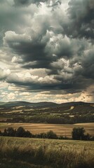 Naklejka na ściany i meble Dramatic clouds over rural landscape