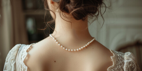 Wedding jewellery, elegant bride jewelry. Woman neck with pearl necklace, back view.