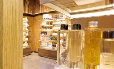 buying make up at cosmetics section in store. choosing cosmetics, perfumes, creams and shampoos