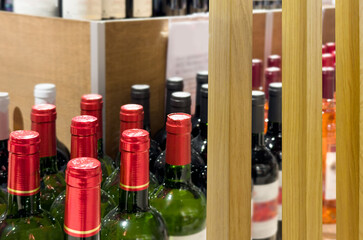 defocused alcohol (wine, champagne, liquor, whiskey) on store shelves