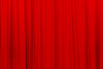 Red theater curtain that dropped down as a straight line. Background for inserting text, empty spaces.