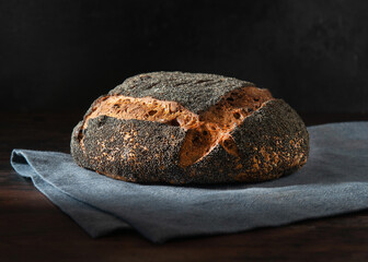 Homemade sourdough bread. Fresh Sourdough bread on a black background.