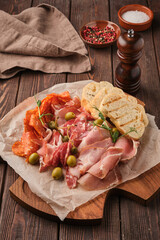 gourmet meat platter with bread and spices
