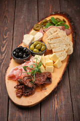 gourmet charcuterie board on rustic wooden table - 763119093