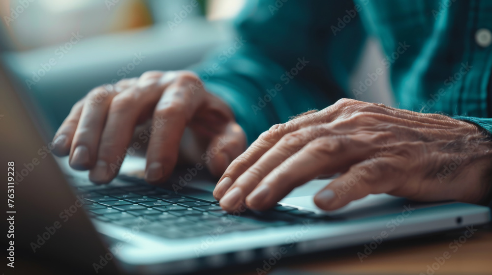 Poster close-up of hands typing on a backlit laptop keyboard in a dimly lit setting.