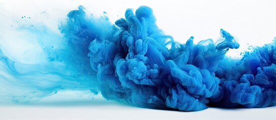 Blue ink is mixing with water creating an electric blue geological phenomenon on a white canvas. This art event resembles cumulus clouds in a freezing magenta sky - obrazy, fototapety, plakaty