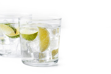 Glass of vodka tonic cocktail isolated on white background. Copy space