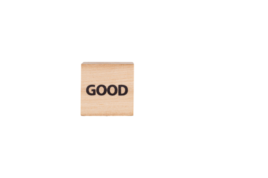 wooden cubes with the inscription Good on a white isolated background close-up