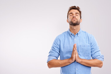 Man, praying and worship with religion for God, seek help and advice for guidance with hands together on white background. Spiritual, faith and gratitude with thanks, praise and forgiveness with hope