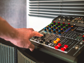 Sound engineer hands adjusting control sound mixer in recording, broadcasting studio,Sound mixer....