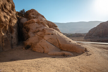 Fototapeta na wymiar Rocky Stone in Petra during Sunny Day in Middle East. Beautiful Scenery of Rock in the Unesco Landscape in Jordan.