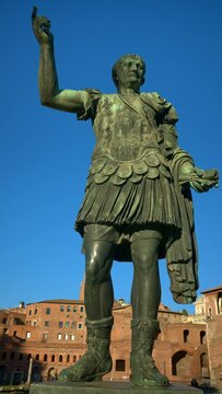 Vertical shot of Julius Caesar statue at sunset in Rome, Italy