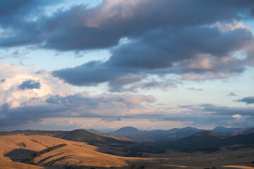 Beautiful landscape, hills in the highlands illuminated by the sun at sunset. Serbia, Zlatibor
